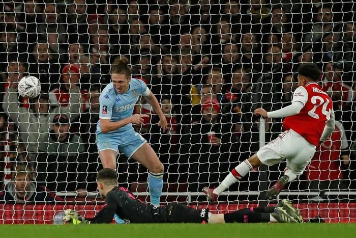 Arsenal's Reiss Nelson (right) scores the only goal of Monday's third round FA Cup clash with Leeds