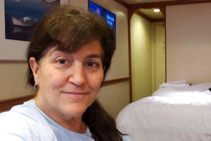 This handout photo released by Carolyn Wright, a passenger on the Grand Princess cruise ship, shows her taking a selfie alongside her friend Beryl Ward in their cabin on the ship on March 7, 2020.