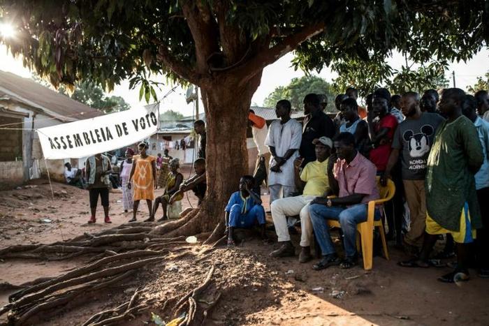 Officials count first-round votes at a polling station in the popular Bairro Militar area of Bissau in November 2019