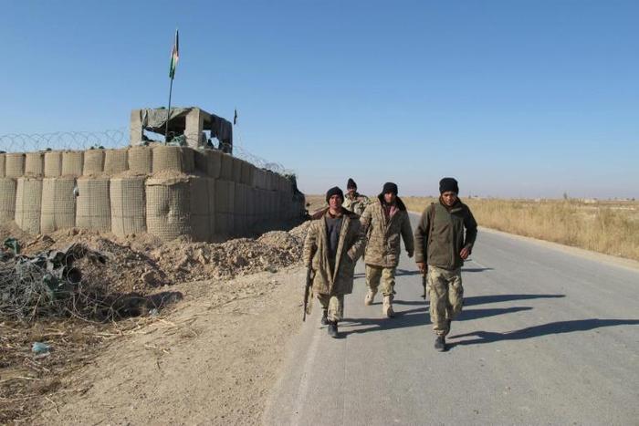 Afghan troops patrol in Helmand province. Deadly violence continues to grip Afghanistan even as the US and the Taliban negotiate on-off talks aimed at reducing America's military footprint