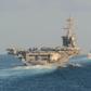 The aircraft carrier USS Abraham Lincoln and its strike group travelled through the Strait of Hormuz this week, a first for a US carrier since April