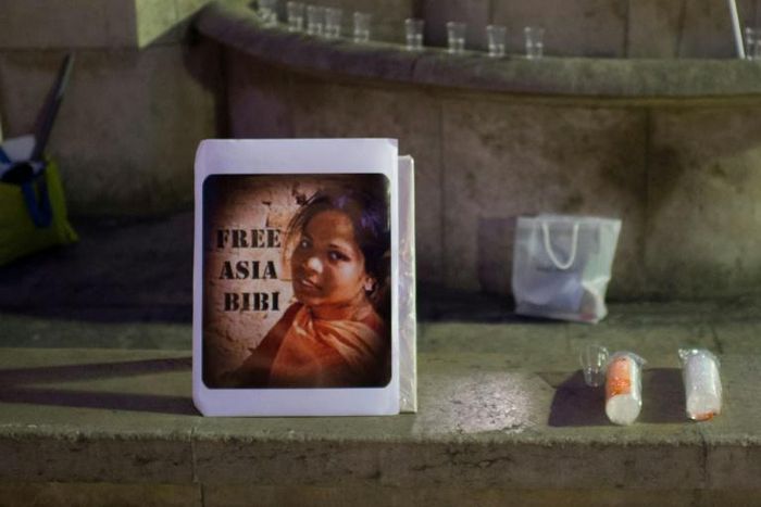 In this file photo taken on October 29, 2014, a portrait of Pakistan's Asia Bibi is displayed during a demonstration to protest against her death sentence, in Paris; she has sought political asylum from France