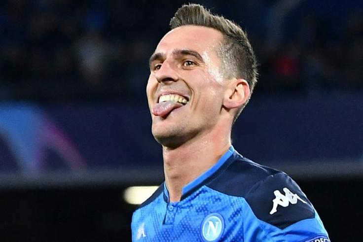 Napoli's Polish forward Arkadiusz Milik celebrates after scoring his second goal during the UEFA Champions League Group E football match Napoli vs Genk on December 10, 2019 at the San Paolo stadium in Naples.