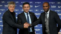 Barcelona's new coach Quique Setien (left) poses with club president Josep Maria Bartomeu (centre) and sporting director Eric Abidal (right) during his official presentation on Tuesday.