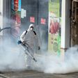 Iranian firefighters and municipality workers disinfect streets in the capital Tehran in a bid to halt the wild spread of coronavirus