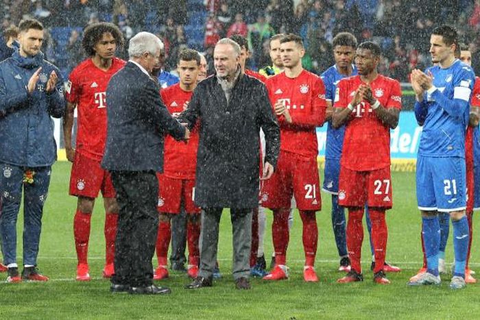 Hoffenheim owner Dietmar Hopp shakes hands with Bayern chief executive Karl-Heinz Rummenigge