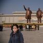 Pyongyang residents pay their respects at the giant bronze statues of Kim Il Sung and his son and successor Kim Jong Il