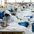 Ugly Duck Industry in Wenzhou, eastern China, has switched production from winter coats to hazmat suits