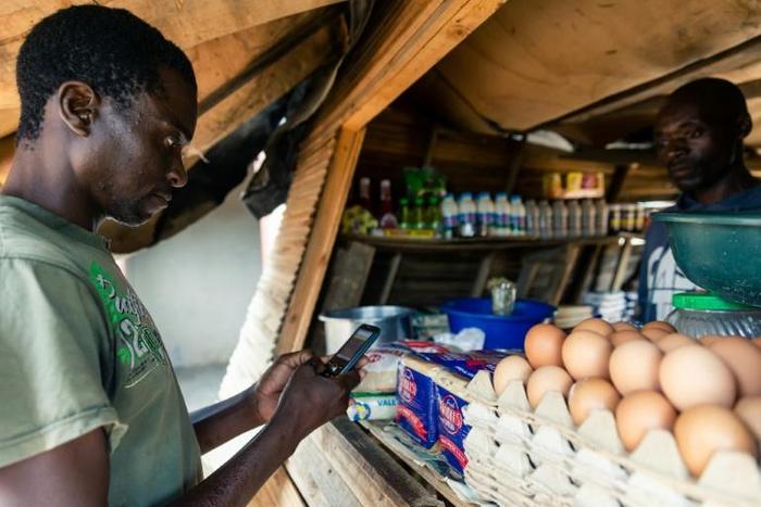 An SMS for the SOS: Aaron Munyoro receives $9 month in cash aid via his mobile phone -- a lifeline for his impoverished family