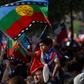 A child holds a Mapuche indigenous flag during a march in Santiago on November 01