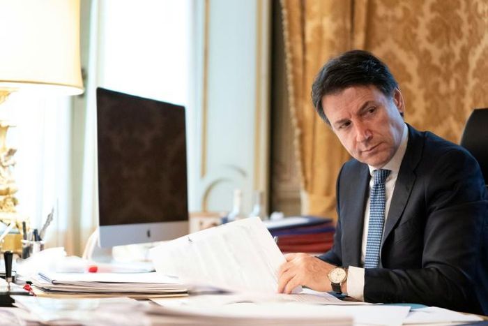 Italian prime minister Giuseppe Conte (pictured March 2020 in a handout photo from the Palazzo Chigi press office) has come under attack from political rivals in Rome for agreeing to the EU's bailout plan