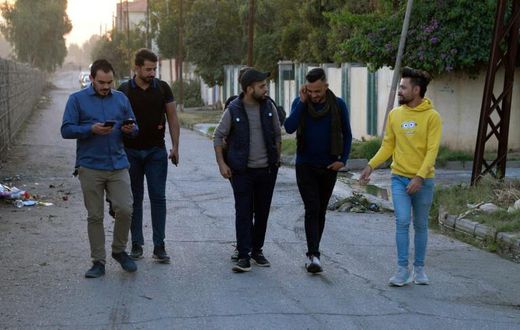 Young men in Iraq's second city Mosul ahead of performing a local adaption of famous Italian resistance song 'Bella Ciao'