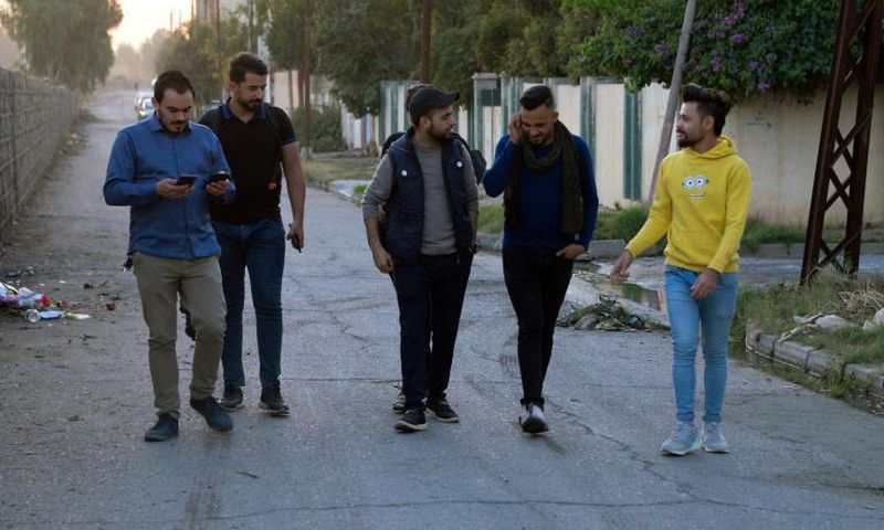 Young men in Iraq's second city Mosul ahead of performing a local adaption of famous Italian resistance song 'Bella Ciao'
