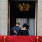 (FILES) In this file photo taken on July 10, 2018 Britain's Meghan, Duchess of Sussex (R) puts her hand on Britain's Prince Harry, Duke of Sussex's back; Britain's Prince Harry and his wife Meghan will give up their titles and stop receiving public fun...