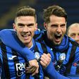 Atalanta defender Robin Gosens (L) celebrates with Hans Hateboer (R) as debutants Atalanta reached the Champions League last 16