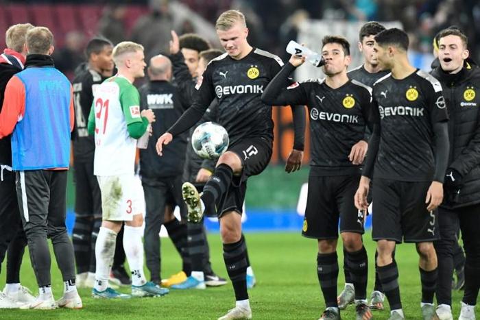 Erling Braut Haaland (C) has needed a total of 59 minutes to score a record five goals in his first two league games for Borussia Dortmund.
