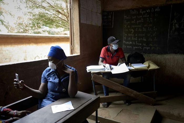 Electoral officials wore masks and gloves as a preventive measure against the spread of the coronavirus during Mali's parliamentary elections