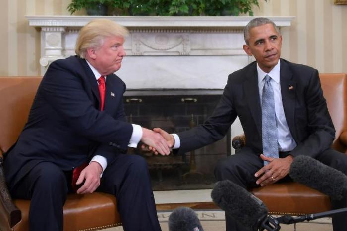 The White House transition from Barack Obama to Donald Trump (the pair are seen here after Trump's election in November 2016) has been one of the most stark in US history