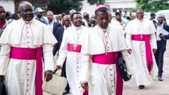 Catholic bishops arrive for the signing of an accord at the inter diocesan centre in Kinshasa on January 1, 2017 following talks launched by the Roman Catholic Church between the government and opposition