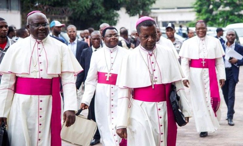 Catholic bishops arrive for the signing of an accord at the inter diocesan centre in Kinshasa on January 1, 2017 following talks launched by the Roman Catholic Church between the government and opposition