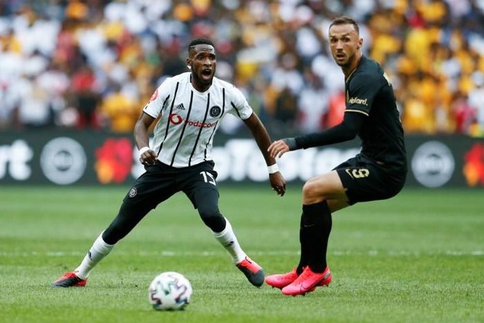 Fortune Makaringe (L) of Orlando Pirates and Samir Nurkovic of Kaizer Chiefs eye possession during a South African Premiership match in Soweto last month that drew a 90,000 crowd