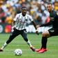 Fortune Makaringe (L) of Orlando Pirates and Samir Nurkovic of Kaizer Chiefs eye possession during a South African Premiership match in Soweto last month that drew a 90,000 crowd