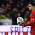 Philippe Coutinho walks off with the match ball after his hat-trick against Werder Bremen