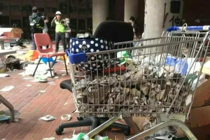A walk inside Polytechnic University on Tuesday afternoon shows the level of destruction in the besieged campus as the number of student protesters holed up inside dwindle