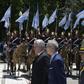 Cuban President Miguel Diaz-Canel (L) takes part in a wreath-laying ceremony to pay homage to Argentine national hero General Jose de San Martin, at San Martin Square in Buenos Aires on Monday