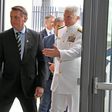 Brazilian President Jair Bolsonaro(C), is greeted by Commander, US Southern Command Admiral Craig Faller(R) in Miami, Florida on March 8, 2020; Brazil's leader was there to discuss growing bilateral defense-cooperation partnership