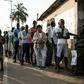 People wait to cast their vote in Bissau, the capital