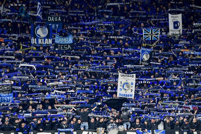 Atalanta fans cheer during the UEFA Champions League football match between Atalanta Bergamo and Valencia on February 19, 2020 at the San Siro stadium in Milan