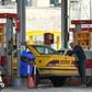 Iranian motorists fill up at a petrol station in the capital Tehran