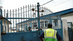 Worshippers clustered at the gate of Makoko's Celestial Church of Christ only to find policemen handing out fliers on the dangers of the virus