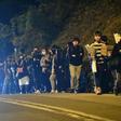 Mourners arrive to pay their respects at a memorial service for Hong Kong student Alex Chow, 22
