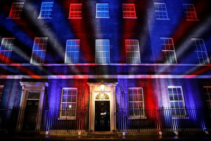 Red, white and blue lights illuminate 10 Downing Street, the official residence of Britain's Prime Minister, in central London after Britain left the European Union