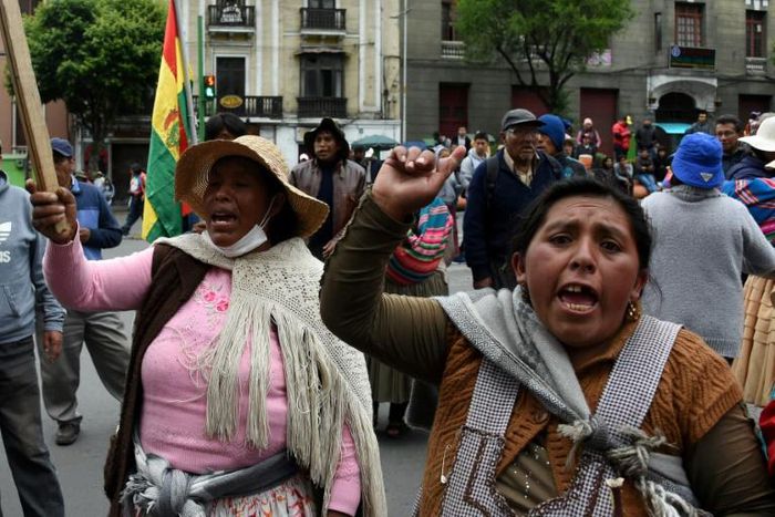 Supporters of Bolivia's ex-president Evo Morales protest in La Paz after he left for exile in Mexico