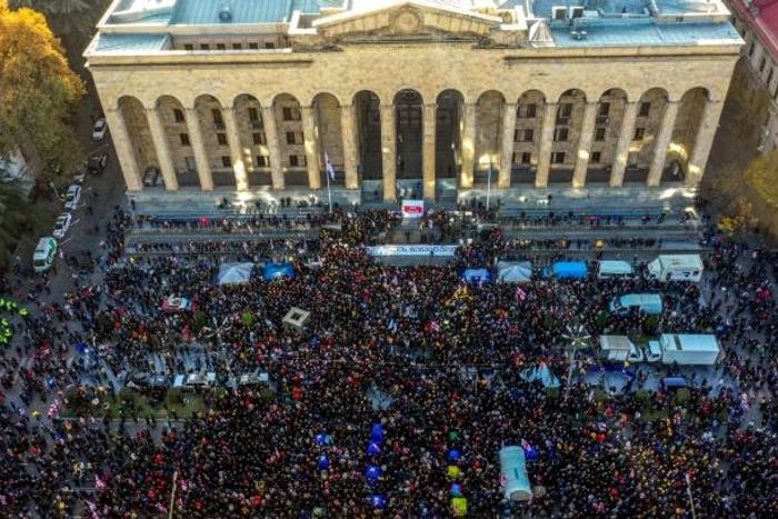 More than 20,000 demonstrators rallied outside the parliament building in Tbilisi urging the government to resign and calling for new legislative elections