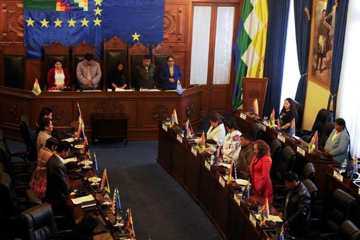 Senators observe a minute of silence at the beginning of a session at Bolivia's Congress  in La Paz, on November 23, 2019