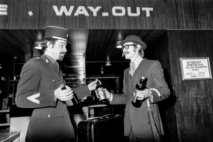 A Briton celebrates his country's membership of the European Economic Community with a French customs officer on January 1, 1973 in Le Havre