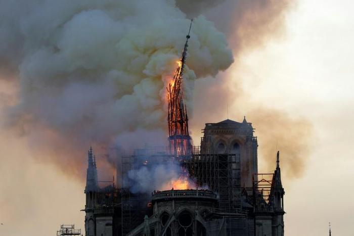 Notre Dame, part of a UNESCO world heritage site on the banks of the River Seine lost its gothic spire, roof and many precious artefacts in the fire, which was watched by huge crowds

A huge fire swept through the roof of the famed Notre-Dame Cathedral...