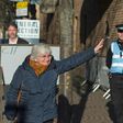 Demonstrators holding Catalan and Scottish independence flags greeted former Catalan education minister Clara Ponsati as she arrived to hand herself in at an Edinburgh police station