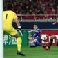 Al-Hilal's Abdullah Otayf (blue) challenges Urawa's Tomoaki Makino during the second leg of their AFC Champions League final  match at Saitama Stadium