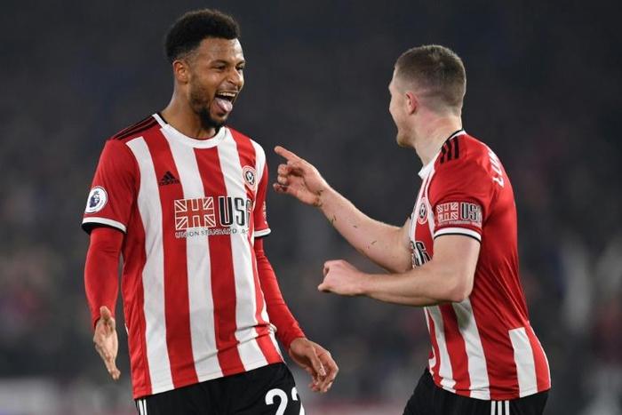Sheffield United's French striker Lys Mousset (left) celebrates scoring against Manchester United