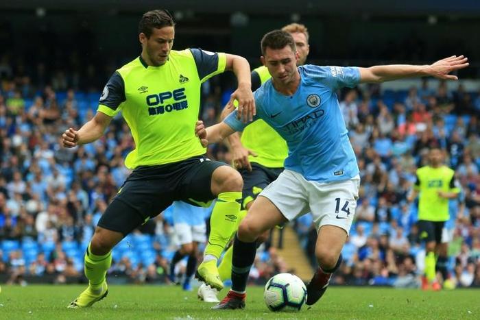 Egyptian Ramadan Sobhy (L) playing for Huddersfield Town against Manchester City last year