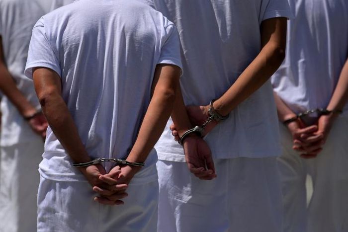 Suspected members of the Barrio 18 gang are pictured at Isidro Menendez Justice Court in San Salvador on February 6