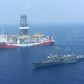 A Turkish navy warship patrols next to Turkey's drilling ship 'Fatih' sent to waters off Cyprus