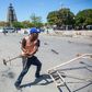 People clean the Champ de Mars, in Port-au-Prince, Haiti, on February 18, 2020, a day after police officers reportedly set fire to carnival stands: the area was completely deserted Monday after police attacked the nearby army headquarters