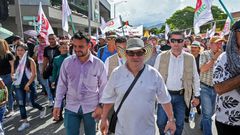 Rodrigo Londono aka Timochenko (C), seen here taking part in a general strike against the government Colombian President Ivan Duque in Medellin in November