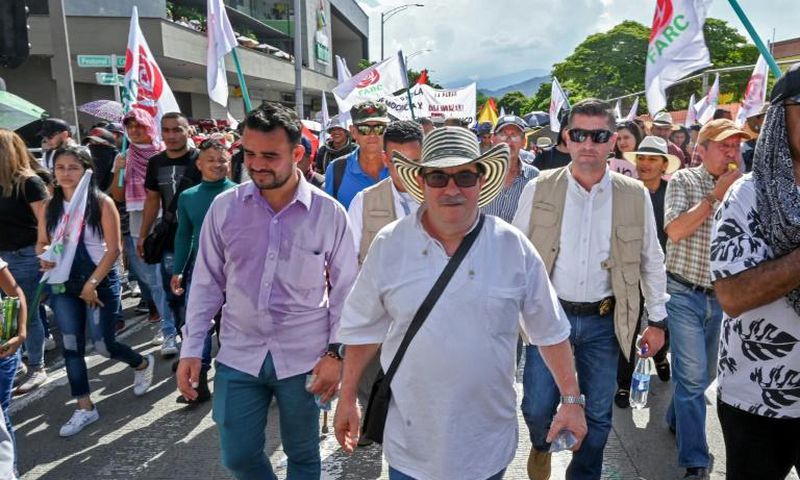 Rodrigo Londono aka Timochenko (C), seen here taking part in a general strike against the government Colombian President Ivan Duque in Medellin in November